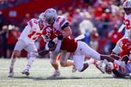 Demario McCall #1 of the Ohio State Buckeyes is tackled by Tommy Eichenberg #35 of the Ohio State Buckeyes
